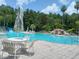 Inviting pool area with lounge chairs and umbrellas, perfect for relaxation and enjoying sunny days at 5125 Palm Springs Blvd # 1303, Tampa, FL 33647