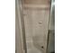 Shower stall featuring tiled walls, a built-in seat, and a glass door at 5125 Palm Springs Blvd # 1303, Tampa, FL 33647
