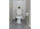 Toilet in a well-lit bathroom with modern flooring at 5125 Palm Springs Blvd # 1303, Tampa, FL 33647