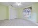 Bright bedroom with pool view, tile floors and ceiling fan at 6359 Cocoa Ln, Apollo Beach, FL 33572