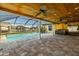 Relaxing pool area with covered patio, hot tub, and water view at 6359 Cocoa Ln, Apollo Beach, FL 33572