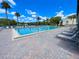 Inviting community pool with lounge chairs at 3114 Lake Pine Way # H2, Tarpon Springs, FL 34688