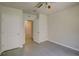 Bedroom with ceiling fan and access to bathroom at 9538 Highland Ridge Dr, Hudson, FL 34667