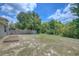 Large backyard with wooden fence and garden at 9538 Highland Ridge Dr, Hudson, FL 34667