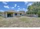 Spacious backyard with a patio and garden area at 9538 Highland Ridge Dr, Hudson, FL 34667