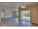 Spacious living area with sliding glass doors and large window at 9538 Highland Ridge Dr, Hudson, FL 34667