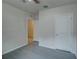 Spacious bedroom with ceiling fan and grey flooring at 9538 Highland Ridge Dr, Hudson, FL 34667