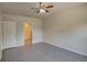 Bright bedroom with ceiling fan and access to bathroom at 9538 Highland Ridge Dr, Hudson, FL 34667