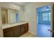 Double vanity bathroom with access to bedroom at 9538 Highland Ridge Dr, Hudson, FL 34667