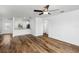 Bright living room with wood-look floors and access to kitchen at 4196 Sea Horse Ave, North Port, FL 34286