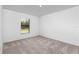 Simple bedroom with neutral walls and carpeted floor at 5473 Colfax Ter, Port Charlotte, FL 33981