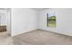 Well-lit bedroom with neutral walls and carpeted floor at 5473 Colfax Ter, Port Charlotte, FL 33981