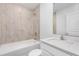 Clean bathroom with a tub, shower, and modern vanity at 5473 Colfax Ter, Port Charlotte, FL 33981