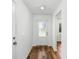 Bright and airy entryway with wood-look flooring at 5473 Colfax Ter, Port Charlotte, FL 33981