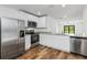 Kitchen with stainless steel appliances and granite countertops at 5473 Colfax Ter, Port Charlotte, FL 33981