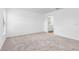 Bright bedroom with neutral carpeting and an en-suite bathroom at 12564 Feldman Ave, Port Charlotte, FL 33981