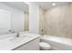 Bathroom with a bathtub, shower, and white vanity at 12564 Feldman Ave, Port Charlotte, FL 33981
