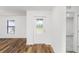Interior view of entryway with white door and wood flooring at 12564 Feldman Ave, Port Charlotte, FL 33981
