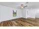 Bright bedroom with wood-look floors and ceiling fan at 12564 Feldman Ave, Port Charlotte, FL 33981