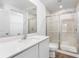Clean bathroom featuring a walk-in shower and quartz countertop at 12564 Feldman Ave, Port Charlotte, FL 33981