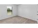 Spacious bedroom with carpeted floor and window with blinds at 5307 Burgner St, Port Charlotte, FL 33981