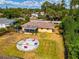 Aerial view of home and backyard with fire pit at 1402 Viscaya Dr, Port Charlotte, FL 33952