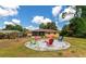 Backyard oasis with firepit and colorful chairs at 1402 Viscaya Dr, Port Charlotte, FL 33952