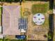 Home and backyard with fire pit, aerial view at 1402 Viscaya Dr, Port Charlotte, FL 33952