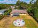 Aerial view showing home and backyard fire pit at 1402 Viscaya Dr, Port Charlotte, FL 33952