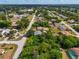 Residential area with homes, lush vegetation and roads at 1402 Viscaya Dr, Port Charlotte, FL 33952
