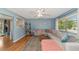 Living room with light beige sectional sofa and wood floors at 1402 Viscaya Dr, Port Charlotte, FL 33952