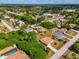 Residential neighborhood with mature trees and a pool at 1402 Viscaya Dr, Port Charlotte, FL 33952