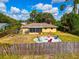 Large backyard with fire pit and seating area at 1402 Viscaya Dr, Port Charlotte, FL 33952
