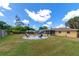 Backyard with firepit and colorful chairs at 1402 Viscaya Dr, Port Charlotte, FL 33952