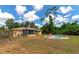 Spacious backyard with fire pit and colorful seating at 1402 Viscaya Dr, Port Charlotte, FL 33952