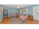 Living room with light beige sectional sofa and wood floors at 1402 Viscaya Dr, Port Charlotte, FL 33952