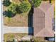 Aerial view of house and driveway, surrounded by trees at 1402 Viscaya Dr, Port Charlotte, FL 33952
