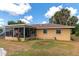 Backyard view of screened patio and home at 1402 Viscaya Dr, Port Charlotte, FL 33952