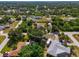Wide aerial view of neighborhood, highlighting a single-Gathering home at 1402 Viscaya Dr, Port Charlotte, FL 33952