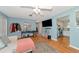 Living area with hardwood floors and view into kitchen at 1402 Viscaya Dr, Port Charlotte, FL 33952