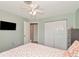 Bedroom with double door closet and starfish bedding at 1402 Viscaya Dr, Port Charlotte, FL 33952