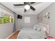 Bedroom with gray walls, queen bed, and wood floors at 1402 Viscaya Dr, Port Charlotte, FL 33952