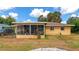 House exterior with a screened porch and backyard at 1402 Viscaya Dr, Port Charlotte, FL 33952