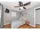 Bedroom with gray walls, queen bed, and wood floors at 1402 Viscaya Dr, Port Charlotte, FL 33952