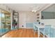 Dining area features a white table and built-in shelving at 1402 Viscaya Dr, Port Charlotte, FL 33952