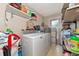 Laundry room with washer, dryer, and extra storage at 1402 Viscaya Dr, Port Charlotte, FL 33952