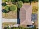 Aerial view of house, driveway, and surrounding trees at 1402 Viscaya Dr, Port Charlotte, FL 33952
