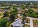 Large home on a residential street with lush landscaping at 1402 Viscaya Dr, Port Charlotte, FL 33952
