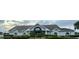 Front exterior view of community center featuring manicured landscaping and ample parking at 10957 Keys Gate Dr, Riverview, FL 33579
