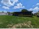 Well-maintained backyard with a screened-in patio, perfect for outdoor living and relaxation at 3931 E Eden Roc Cir, Tampa, FL 33634